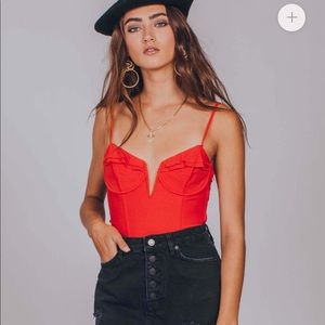 Red bodysuit bustier tip